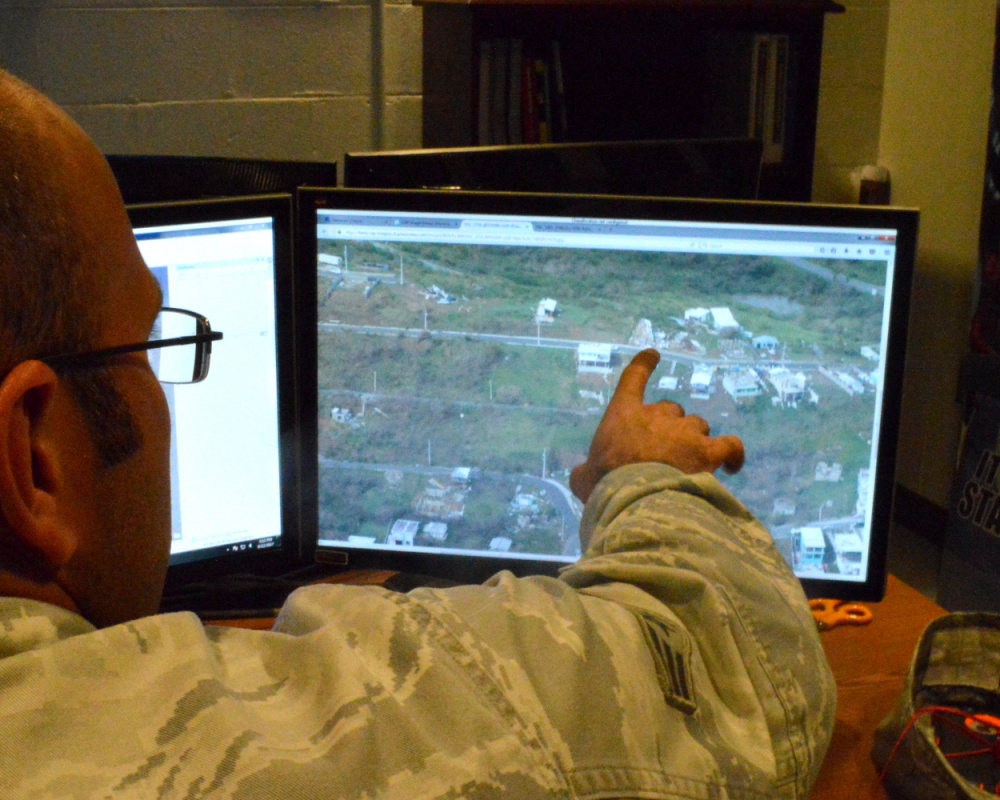 Soldier looking at imagery on a digital display.